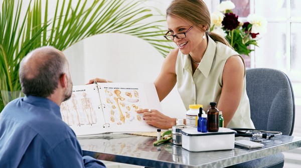 naturopathic doctor with patient