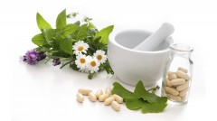 Medicine mixing bowl, pills and flowers